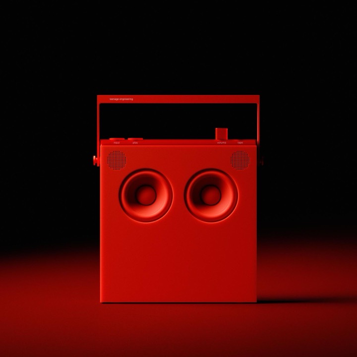 Monochrome red product render of a Teenage Engineering boombox, one hue on black with raking light doing all the form work.