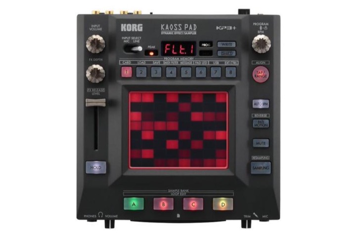 Korg Kaoss Pad KP3+ product shot, matte black slab with a glowing red LED grid pad and color-coded rubber buttons.