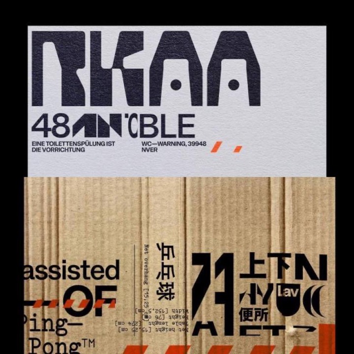 Modular slab display type mashed with Latin, CJK and hazard stripes, printed on cardboard and grey stock for a shipping-label look.