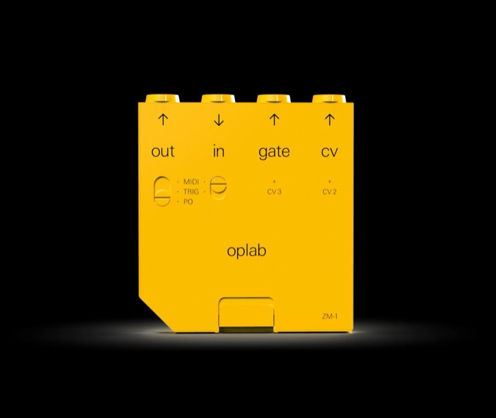 Teenage Engineering's oplab ZM-1 module, a masterclass in minimal hardware labelling: bare arrows, lowercase sans, no decoration on flat yellow.