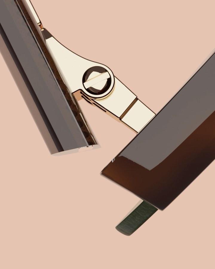 Cropped 3D render of chrome and polished-gold hardware fragments on blush pink, useful for high-gloss metal material studies.