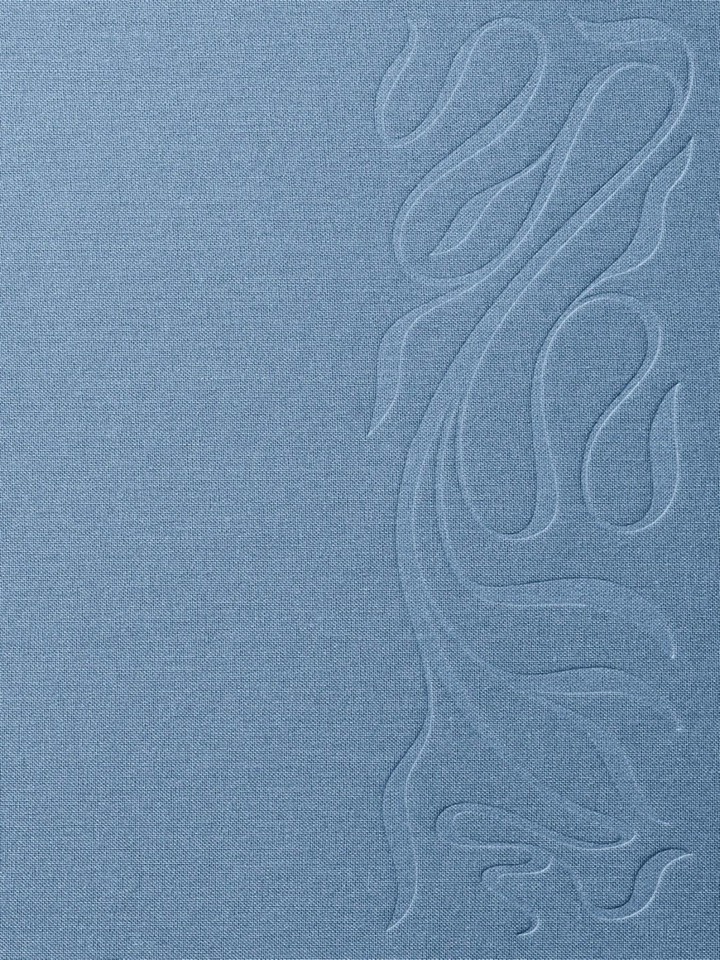 Blind deboss of a crane mark into blue linen cloth, all the identity carried by texture and shadow with zero ink.